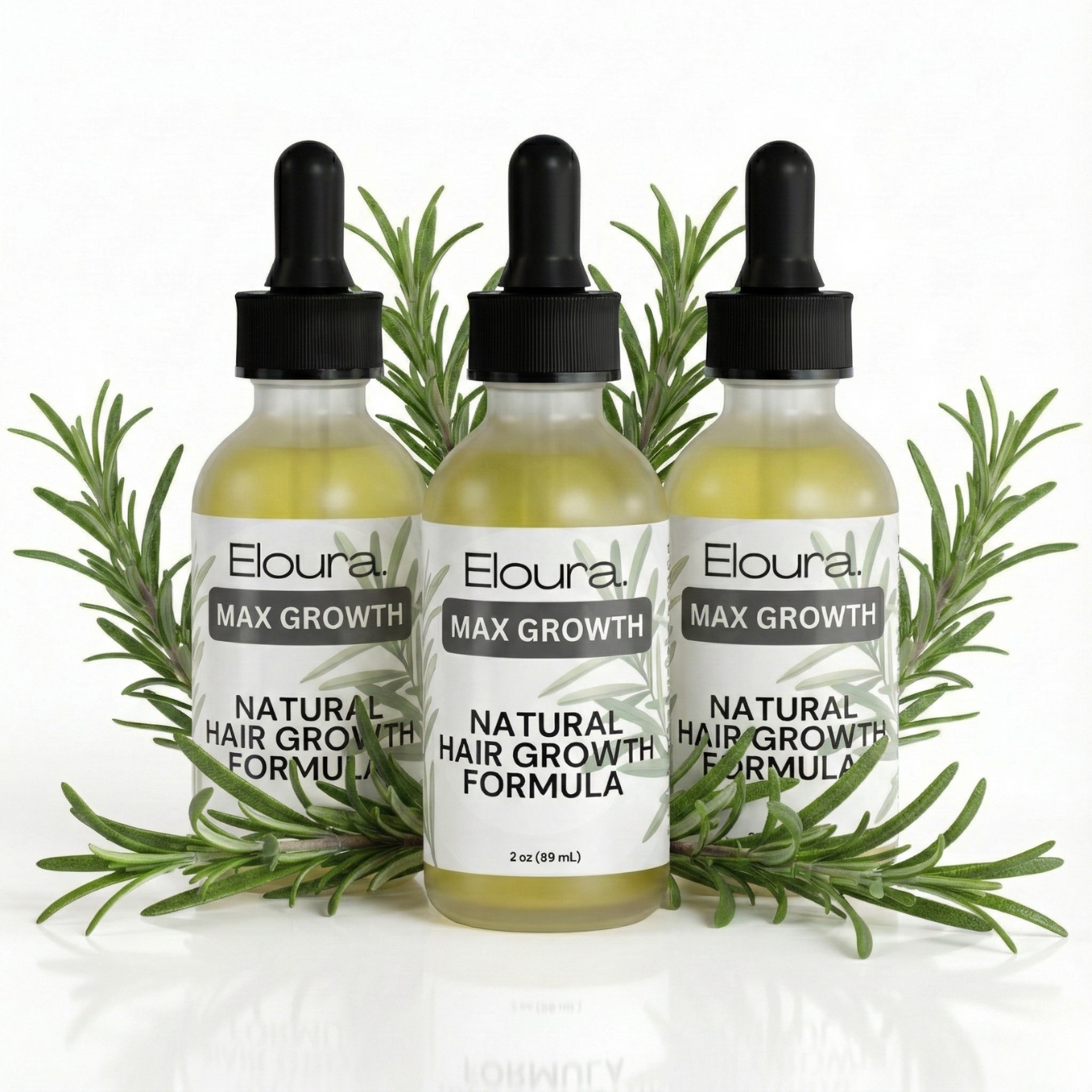 Three bottles of Eloura Max Growth Natural Hair Growth Formula with rosemary leaves on a white background